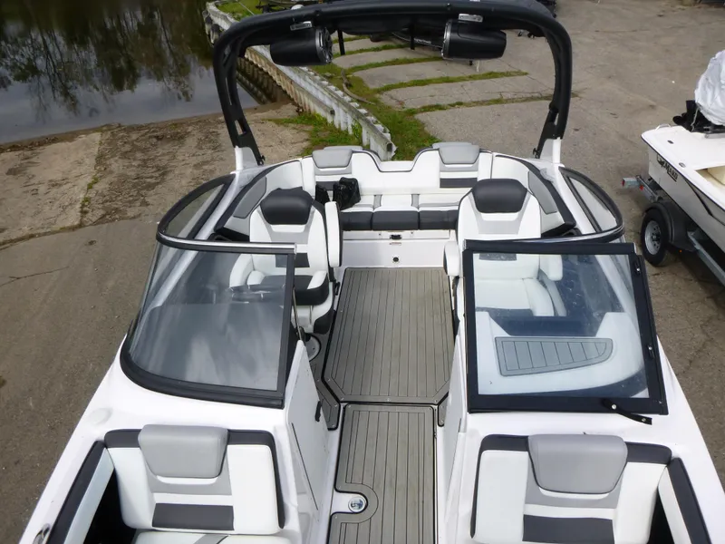 Slide: The Image of 2021 Yamaha Boats 212S interior, featuring sleek seating and modern design. - 20