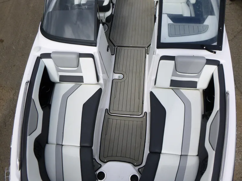 Slide: The Image of 2021 Yamaha Boats 212S interior with sleek seating and modern design. - 21