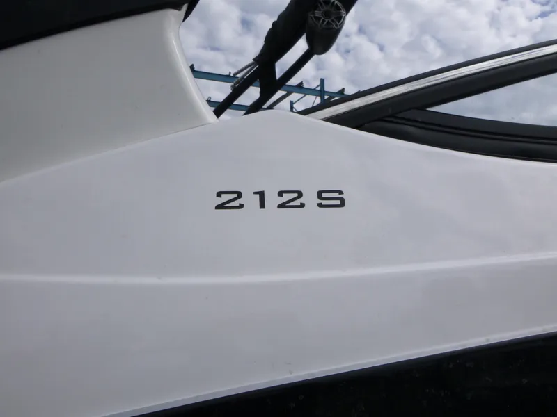 Slide: The Image of 2021 Yamaha Boats 212S model, white exterior detail with logo. - 24