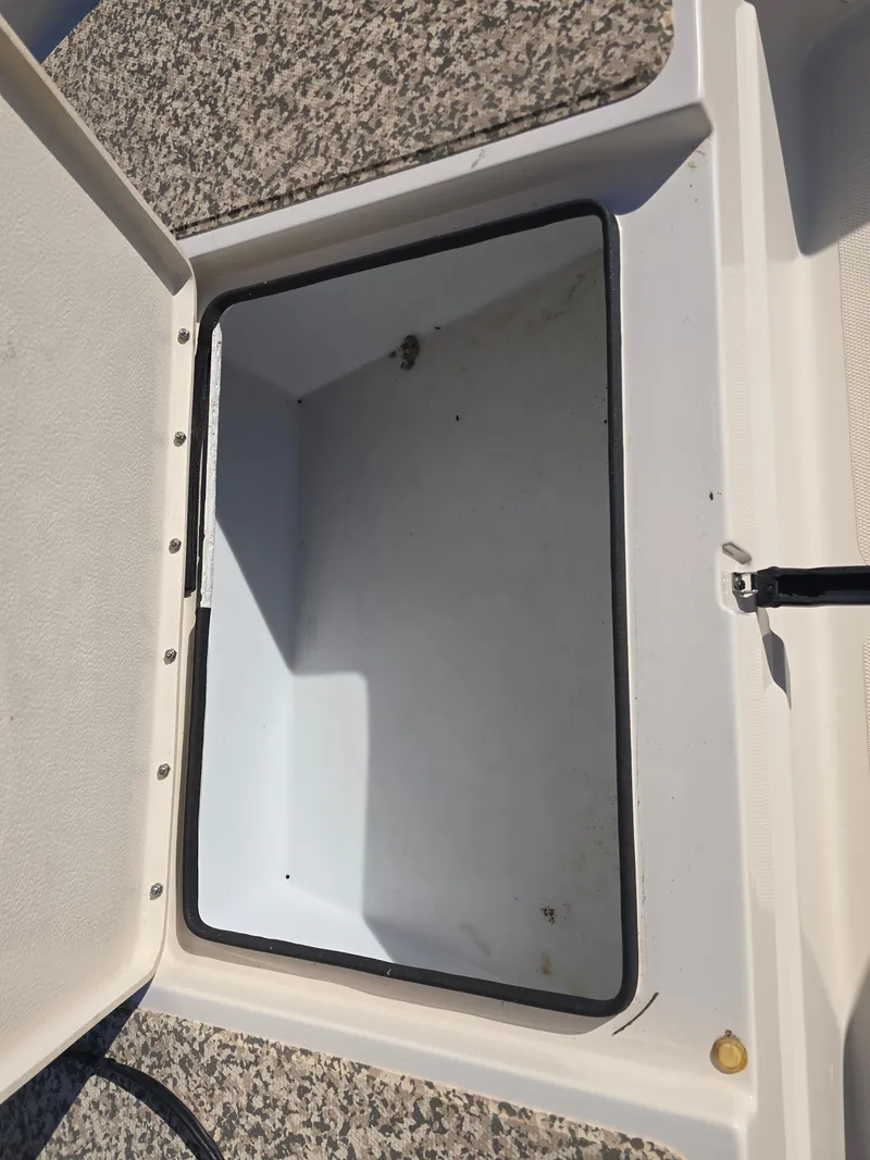 Slide: The Image of Open storage compartment on 2009 Skeeter ZX 20 Bay boat. - 16