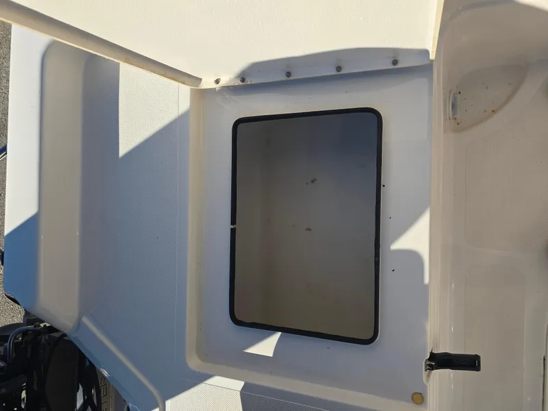 Slide: The Image of 2009 Skeeter ZX 20 Bay boat storage compartment, open and empty. - 17