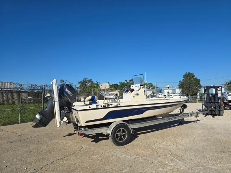 Slide: The Image of 2009 Skeeter ZX 20 Bay boat on trailer under clear blue sky. - 3