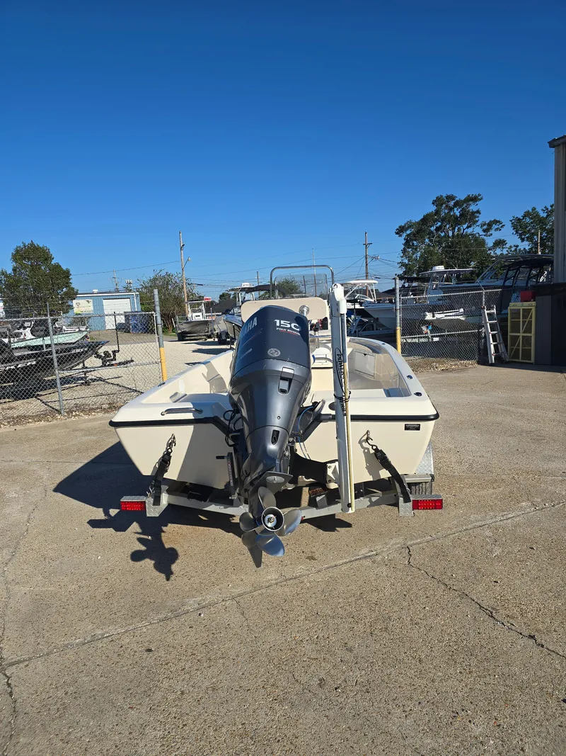 Slide: The Image of 2009 Skeeter ZX 20 Bay boat with outboard motor in a parking lot. - 4