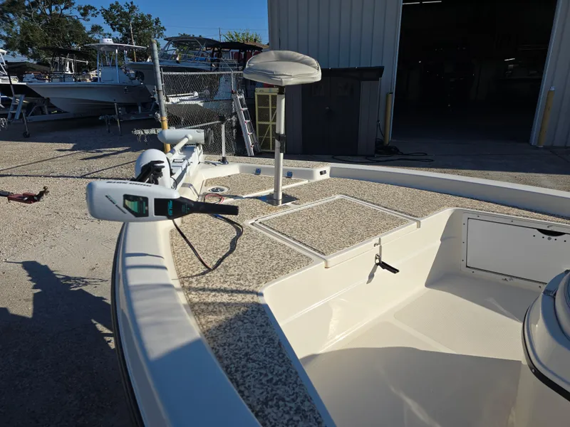 Slide: The Image of 2009 Skeeter ZX 20 Bay boat deck with trolling motor in a marina setting. - 9