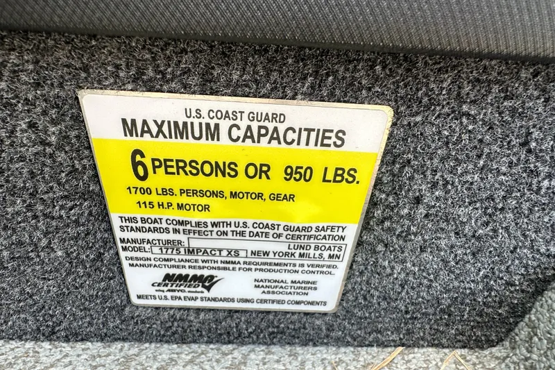 Slide: The Image of 2025 Lund 1775 Impact XS Sport capacity label: 6 persons or 950 lbs, 115 HP motor. - 14