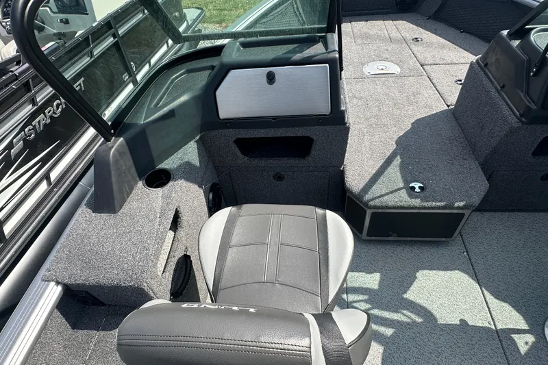 Slide: The Image of 2025 Lund 1775 Impact XS Sport boat interior with seating and storage compartments. - 22