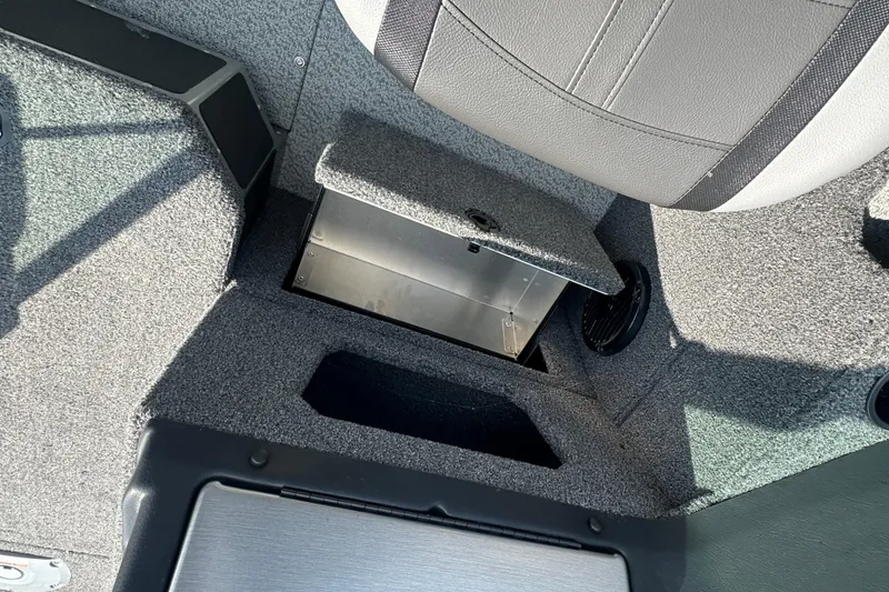 Slide: The Image of Interior storage compartment of 2025 Lund 1775 Impact XS Sport boat. - 23