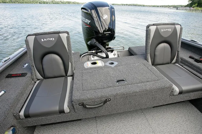 Slide: The Image of 2025 Lund 1775 Impact XS Sport boat with Mercury Pro XS engine, parked outdoors. - 4