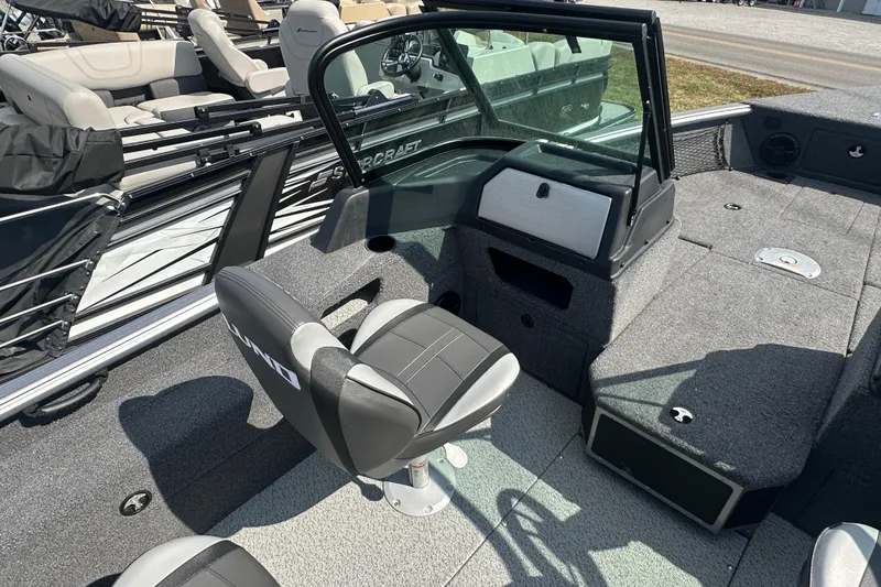 Slide: The Image of 2025 Lund 1775 Impact XS Sport boat interior with seating and console. - 5