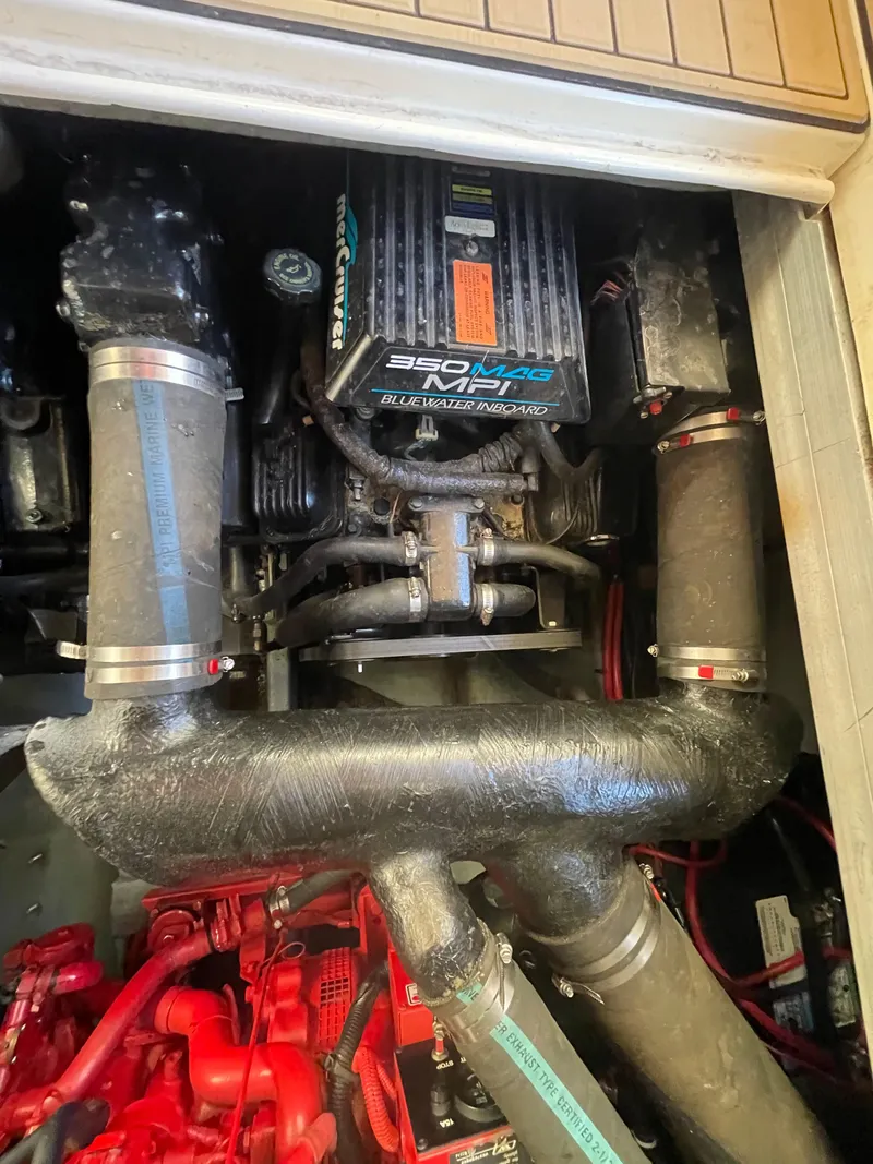 Slide: The Image of Engine compartment of a 1998 Sea Ray 310 boat, featuring a 350 MPI engine. - 16