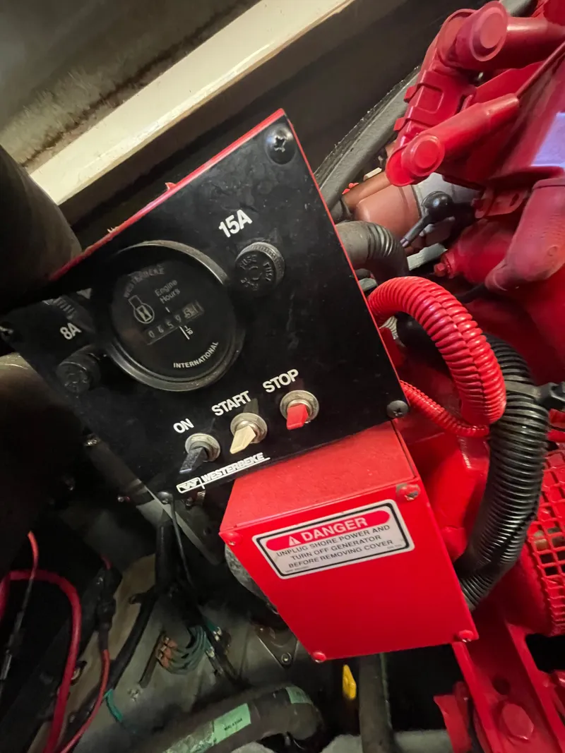 Slide: The Image of Control panel of a 1998 Sea Ray 310 boat engine with warning label. - 18