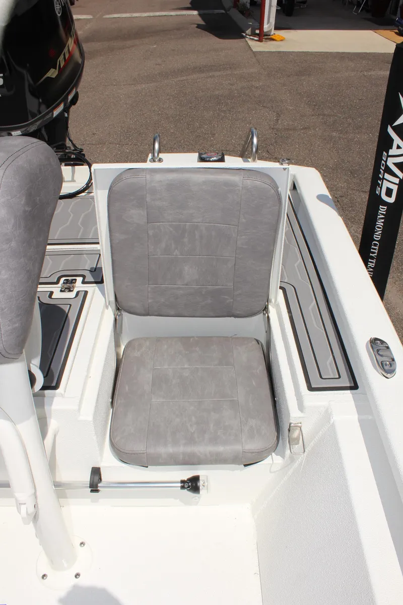 Slide: The Image of 2024 Avid 19 FSX boat seat with gray upholstery. - 11
