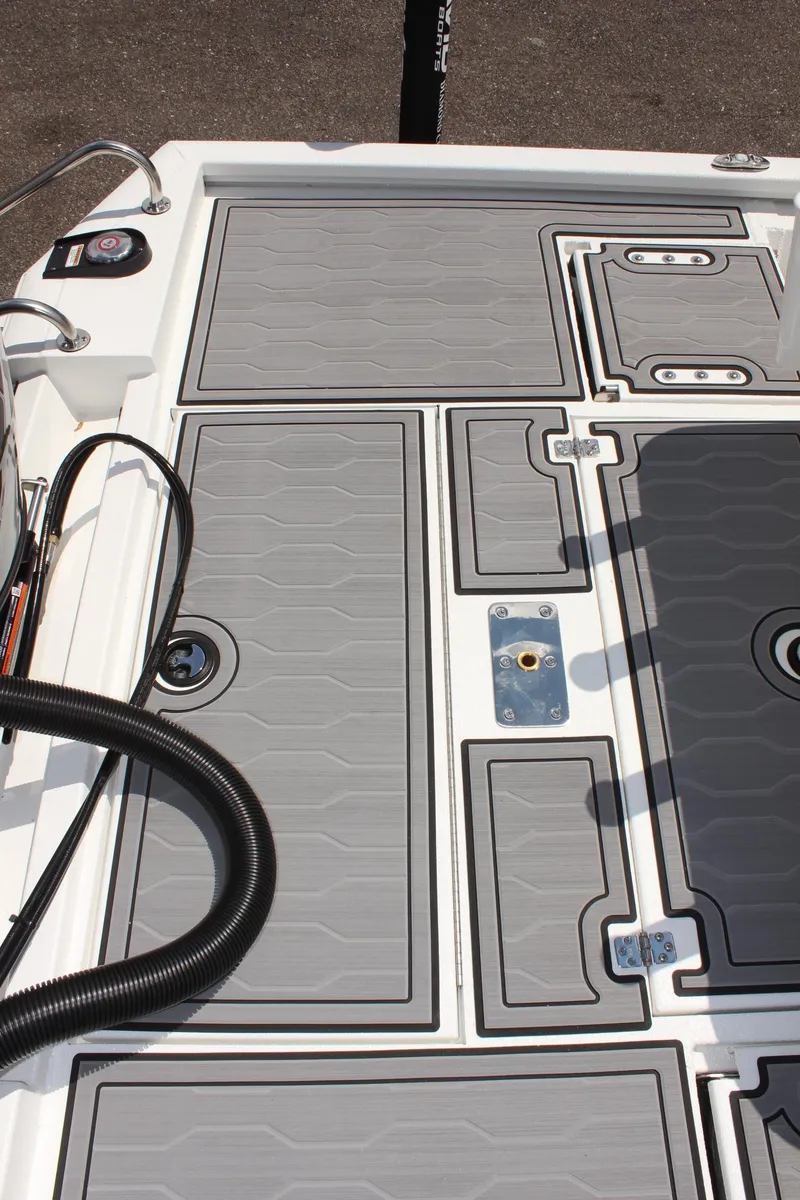 Slide: The Image of 2024 Avid 19 FSX boat deck with sleek gray panels and modern design. - 15