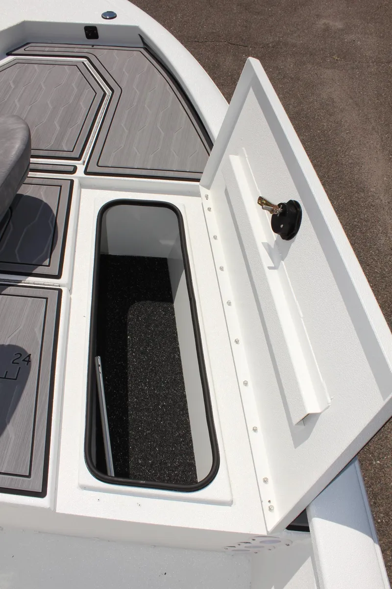 Slide: The Image of 2024 Avid 19 FSX boat storage compartment with open hatch. - 23