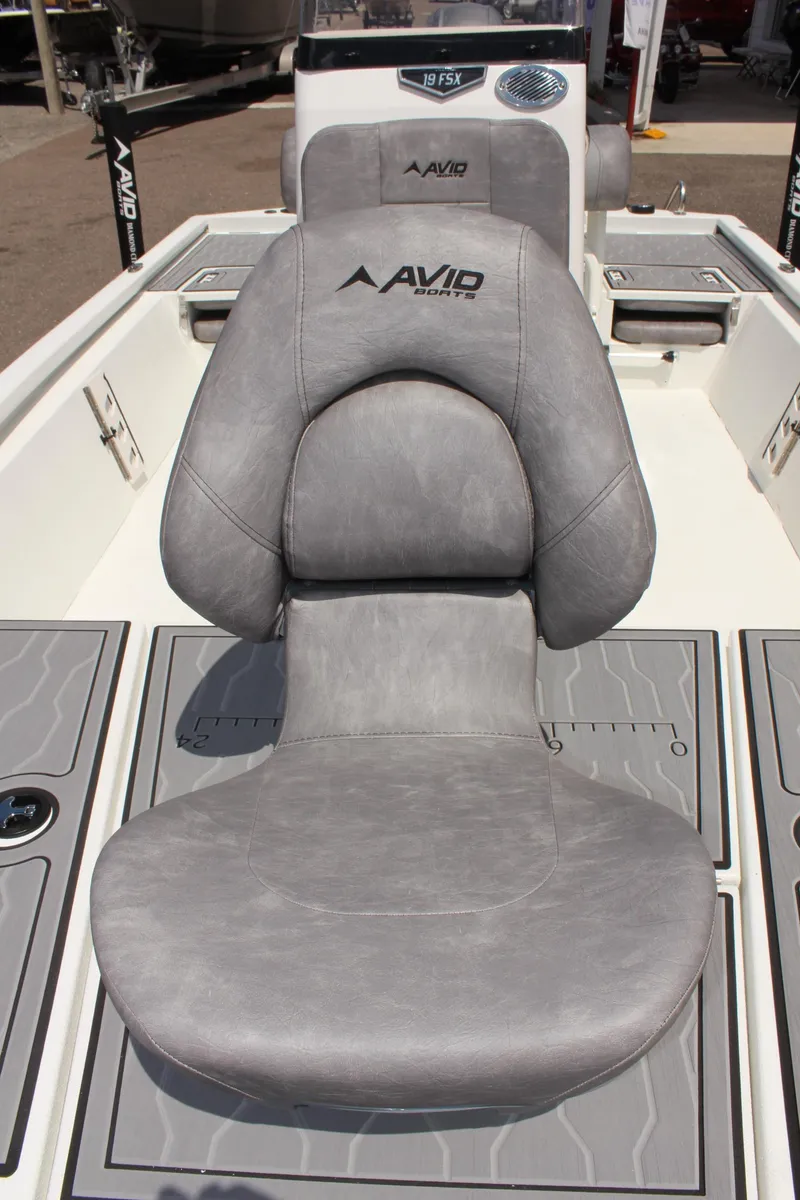 Slide: The Image of 2024 Avid 19 FSX boat with gray cushioned seat and sleek design. - 25