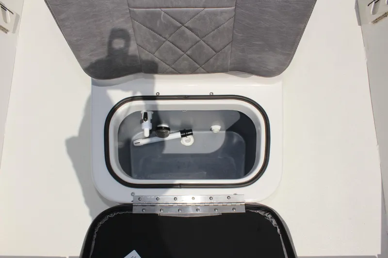 Slide: The Image of 2024 Avid 19 FSX boat livewell with open lid and interior view. - 28