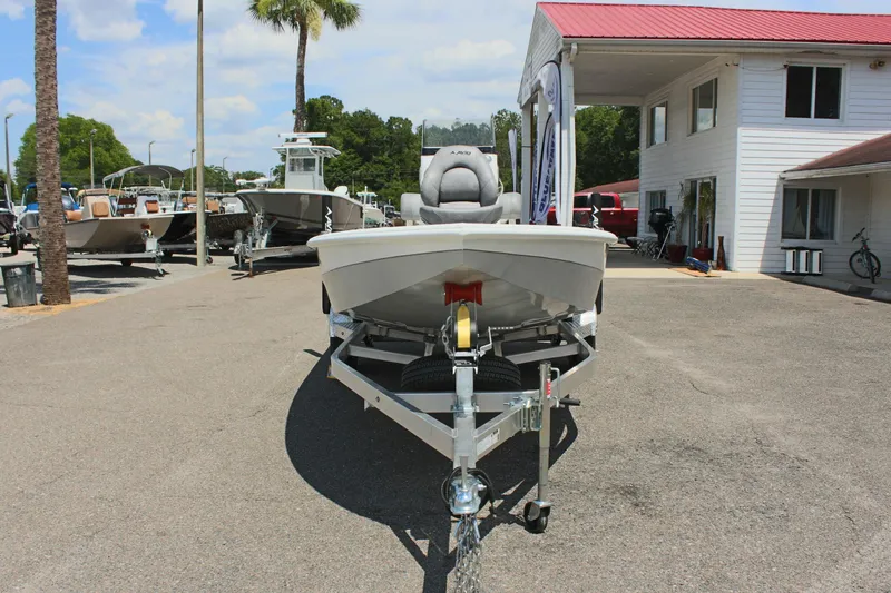 Slide: The Image of 2024 Avid 19 FSX boat on trailer at dealership, sunny day. - 3