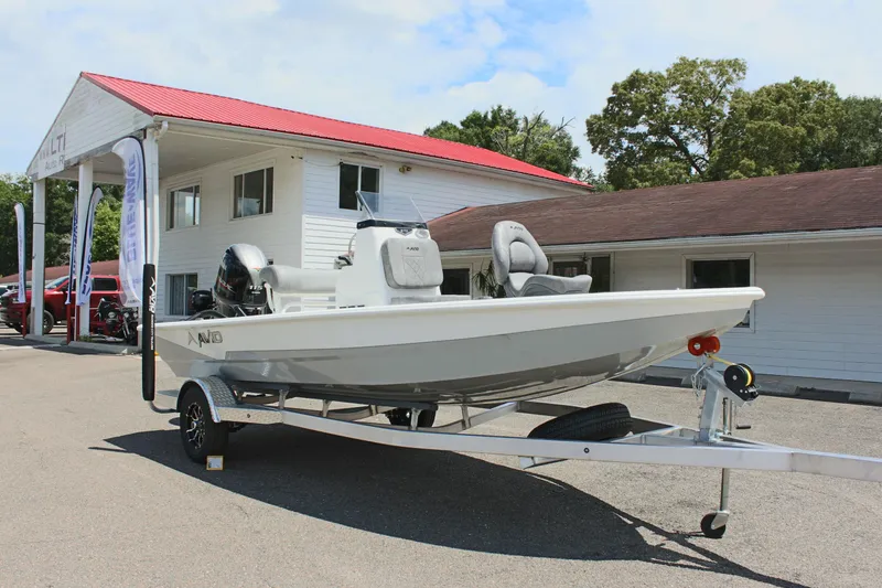 Slide: The Image of 2024 Avid 19 FSX boat on trailer outside dealership. - 4