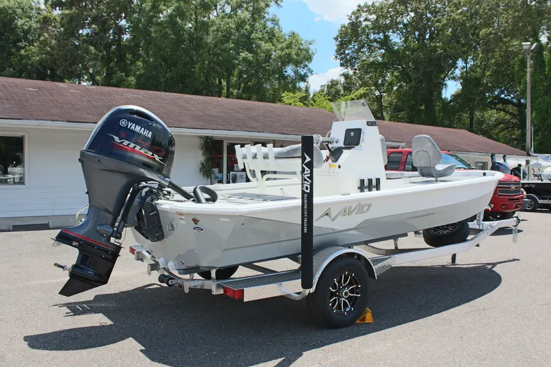 Slide: The Image of 2024 Avid 19 FSX boat with Yamaha engine on trailer, parked outdoors. - 6