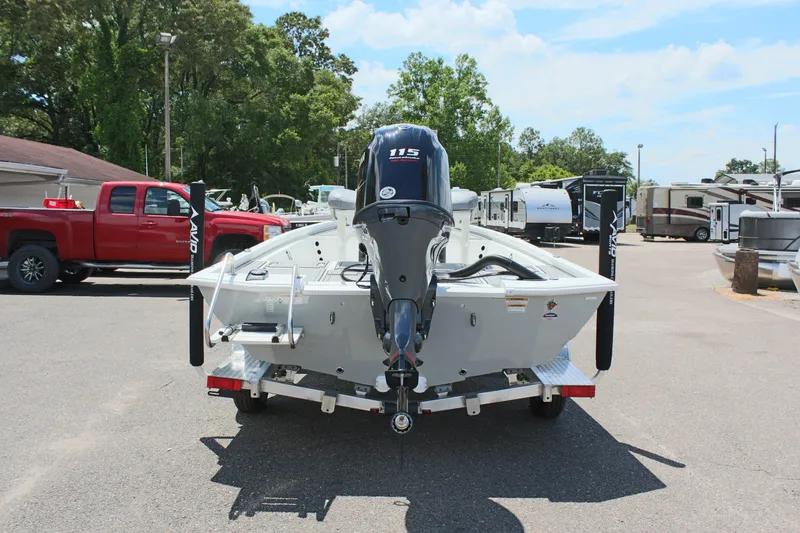 Slide: The Image of 2024 Avid 19 FSX boat with 115 HP engine on trailer in parking lot. - 7