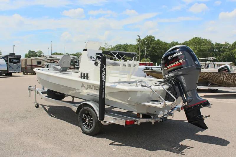 Slide: The Image of 2024 Avid 19 FSX boat with Yamaha outboard motor on trailer. - 8