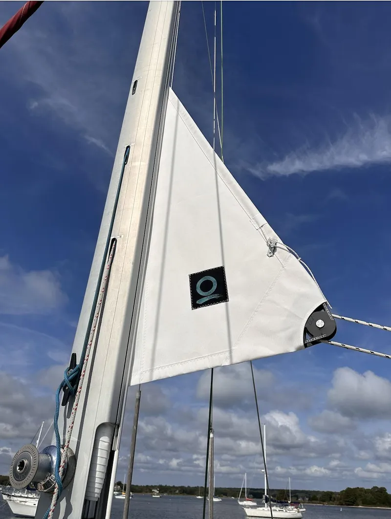 Slide: The Image of Sail of a 2001 Island Packet 320 yacht against a clear blue sky. - 5