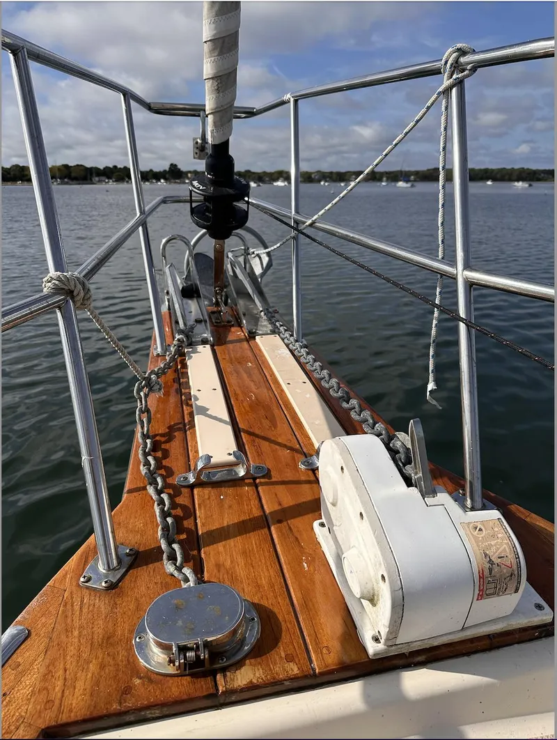 Slide: The Image of Bow of a 2001 Island Packet 320 sailboat with anchor chain and winch. - 6