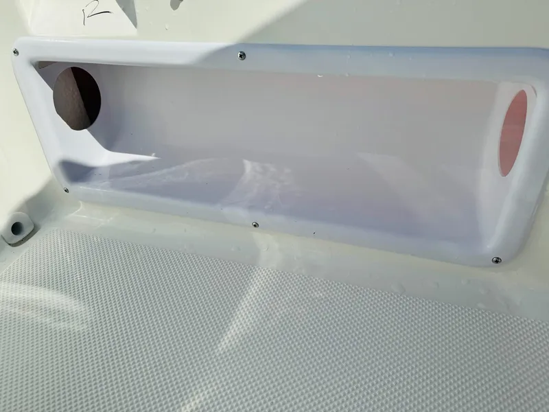 Slide: The Image of Bayliner Element E18 2025 boat interior detail with storage compartment. - 14