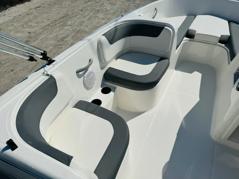 Slide: The Image of 2025 Bayliner Element E18 boat interior with gray and white seating. - 15