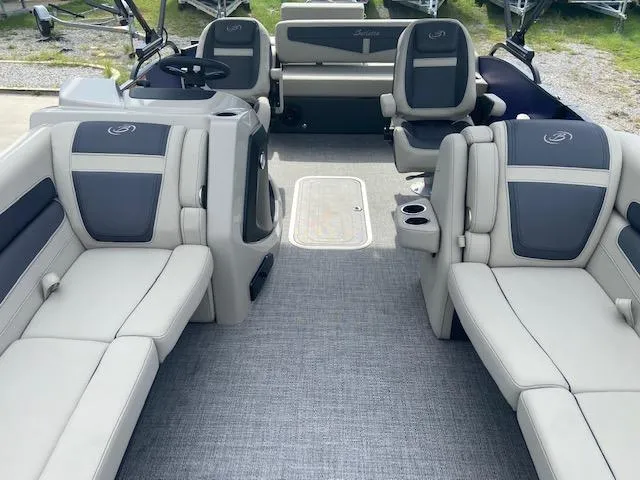 Slide: The Image of 2023 Barletta Cabrio 24 UC pontoon boat interior with plush seating and modern design. - 10