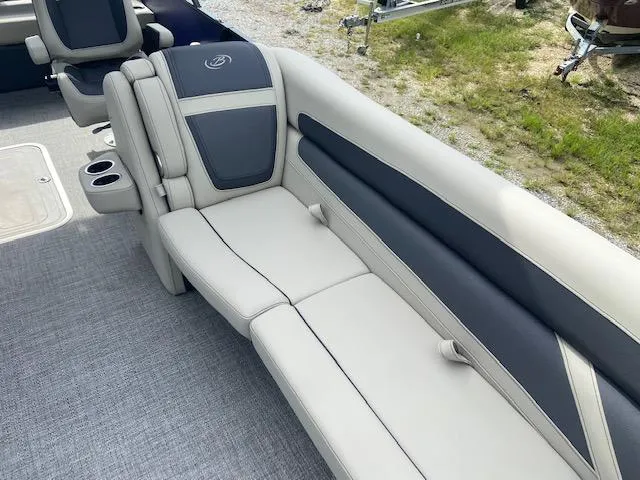 Slide: The Image of 2023 Barletta Cabrio 24 UC boat interior with plush seating and cup holders. - 12