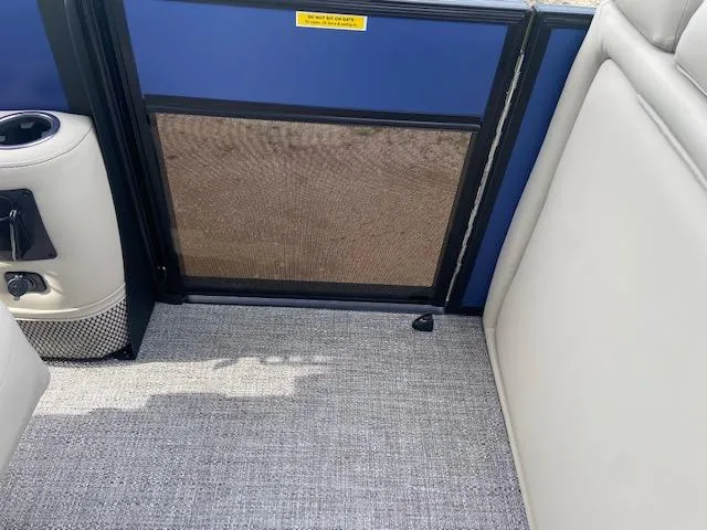 Slide: The Image of Interior of 2023 Barletta Cabrio 24 UC boat with gray carpet and seating. - 14
