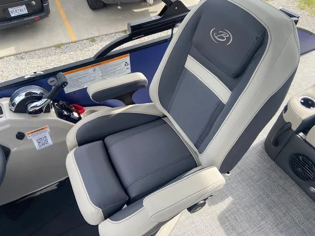 Slide: The Image of Captain's chair in 2023 Barletta Cabrio 24 UC boat, featuring sleek design and comfortable seating. - 15