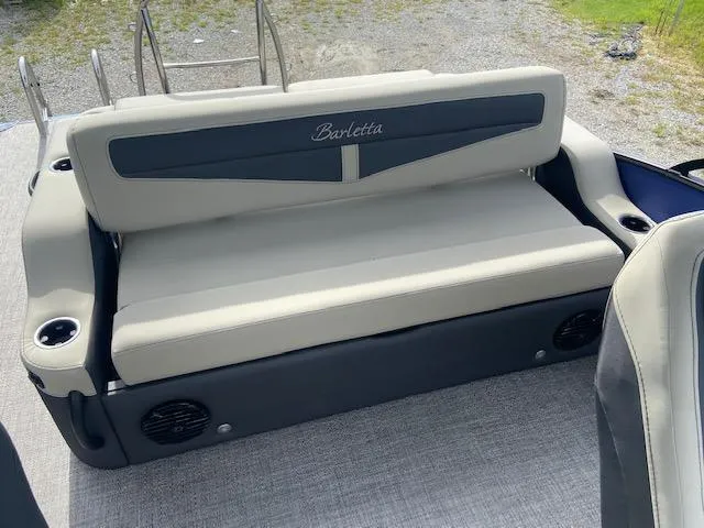 Slide: The Image of 2023 Barletta Cabrio 24 UC boat seating with cup holders and speakers. - 21