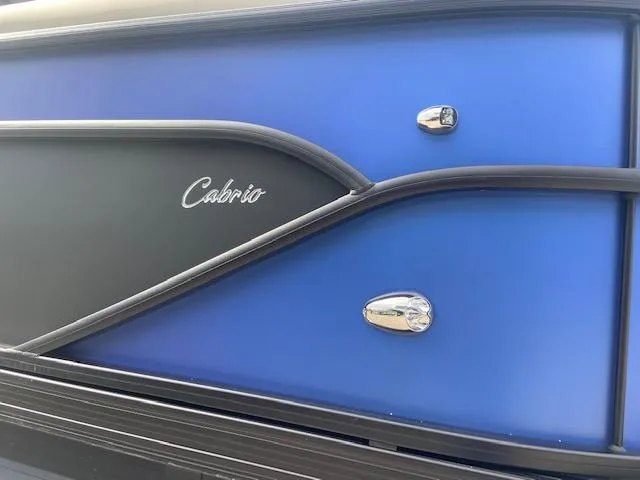 Slide: The Image of 2023 Barletta Cabrio 24 UC boat, featuring sleek blue and black exterior design. - 22