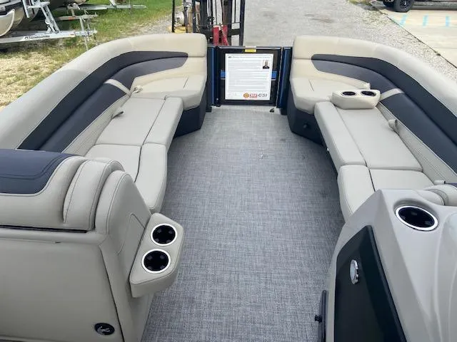 Slide: The Image of 2023 Barletta Cabrio 24 UC pontoon boat interior with plush seating and cup holders. - 7