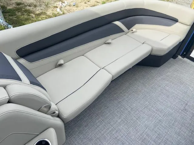 Slide: The Image of 2023 Barletta Cabrio 24 UC boat interior with plush seating and modern design. - 9