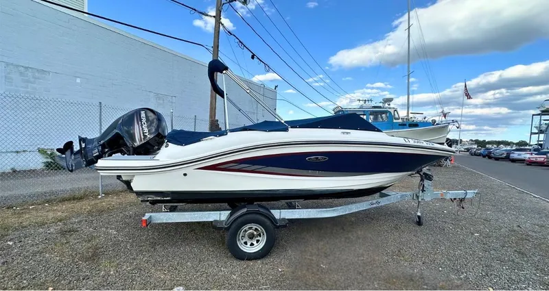 Slide: The Image of 2017 Sea Ray SPX 190 OB boat on trailer, parked outdoors. - 2