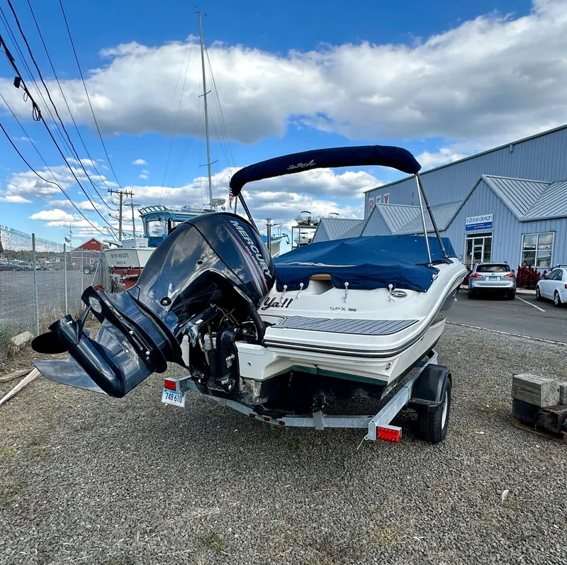 Slide: The Image of 2017 Sea Ray SPX 190 OB boat on trailer, parked outdoors under blue sky. - 3