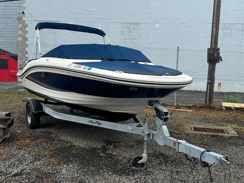 Slide: The Image of 2017 Sea Ray SPX 190 OB boat on trailer, covered and parked outdoors. - 6
