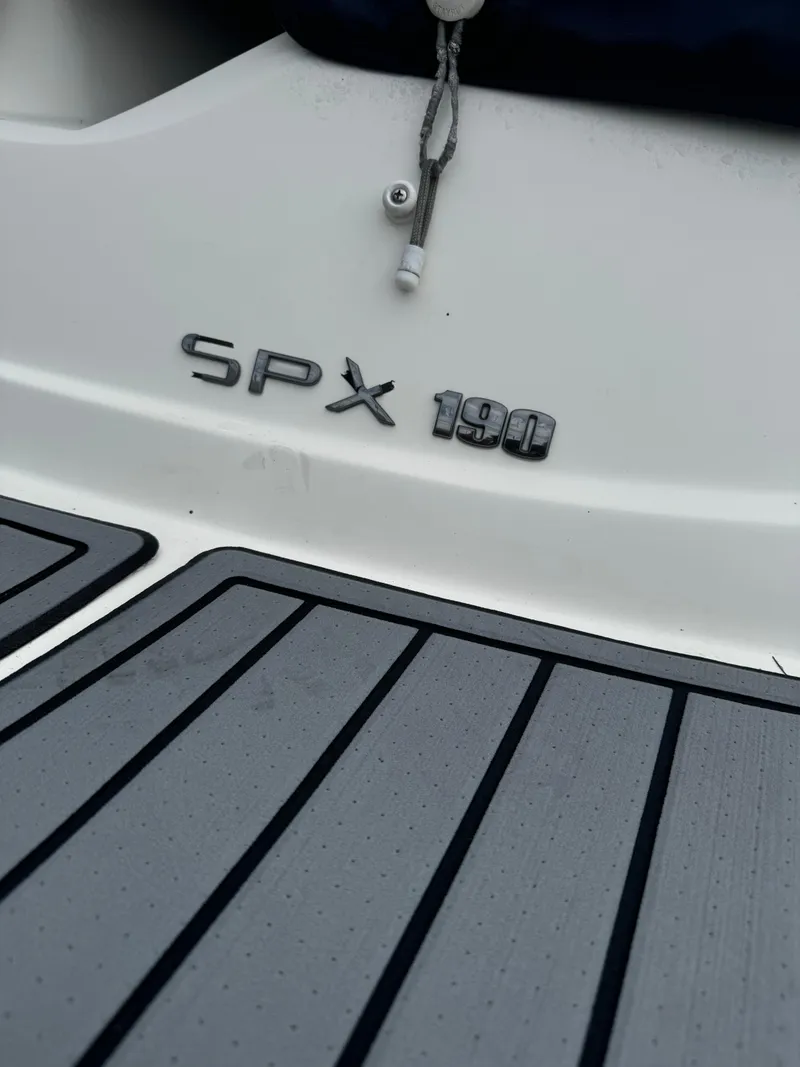 Slide: The Image of 2017 Sea Ray SPX 190 OB boat deck with logo detail. - 8