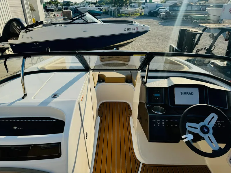 Slide: The Image of 2025 Bayliner VR6 Bowrider OB interior with modern dashboard and steering wheel. - 27