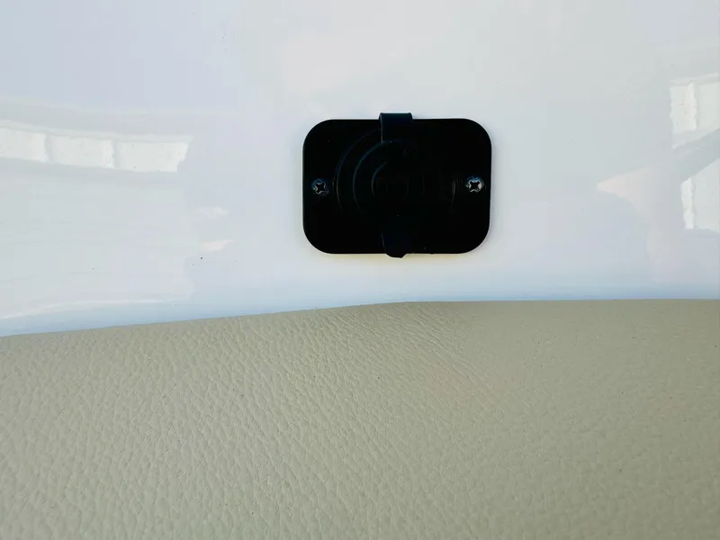 Slide: The Image of 2025 Bayliner VR6 Bowrider OB interior detail with black fixture on beige surface. - 32