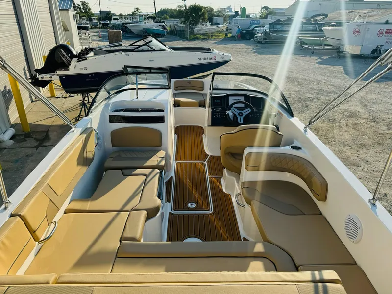 Slide: The Image of 2025 Bayliner VR6 Bowrider OB with tan seating and sleek interior design. - 9