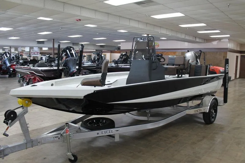Slide: The Image of 2025 Excel Bay Pro Elite 183 boat displayed indoors on a trailer. - 3