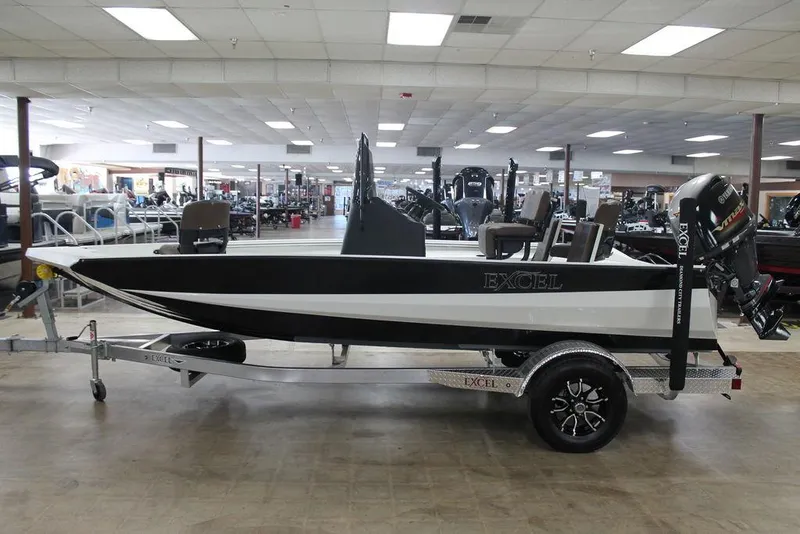 Slide: The Image of 2025 Excel Bay Pro Elite 183 boat on trailer in showroom. - 4