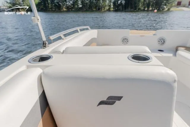 Slide: The Image of 2022 Starcraft SVX 171 OB boat interior with cup holders on a sunny day. - 11