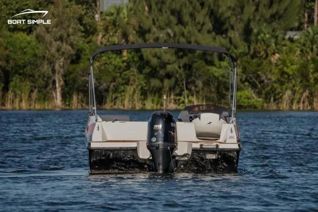 Slide: The Image of 2022 Starcraft SVX 171 OB boat on a serene lake with lush greenery. - 3