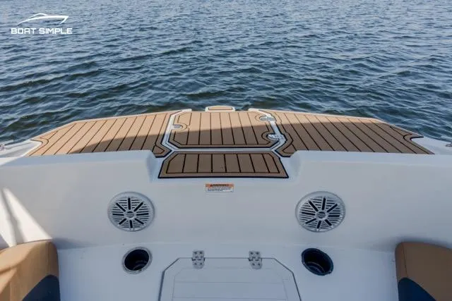 Slide: The Image of 2022 Starcraft SVX 171 OB boat deck with speakers, overlooking calm water. - 5