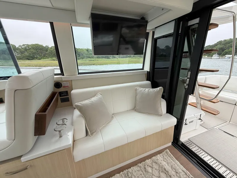 Slide: The Image of Luxurious interior of 2025 Regal 38 FXO yacht with plush seating and modern amenities. - 19